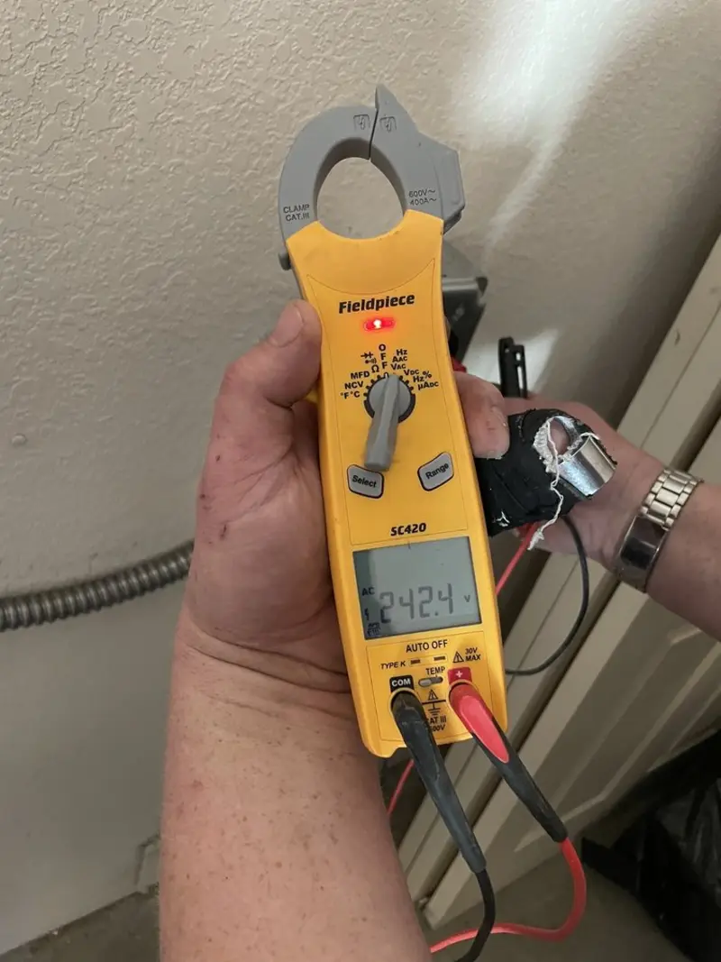 Voltage testing with clamp meter during Generator Installation in Glen Allen